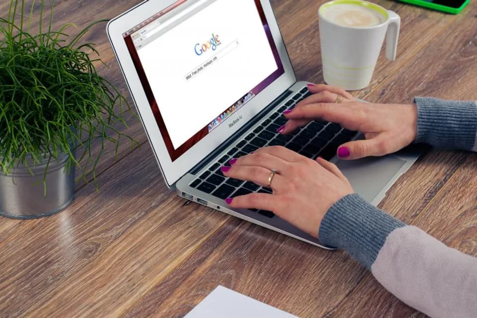 Person searching for information on a laptop
