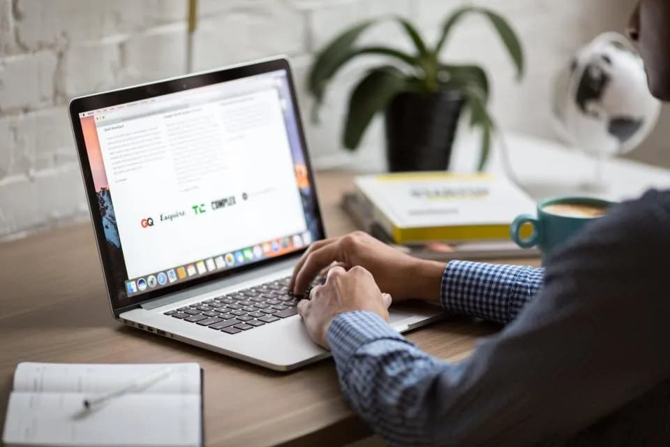 Developer working on a laptop building a headless WordPress website